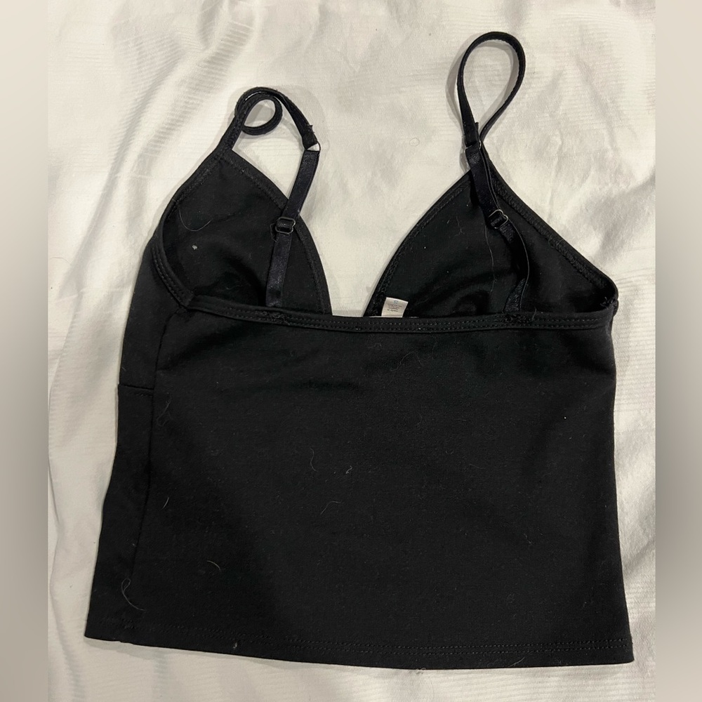 Silence and noise cropped black tank